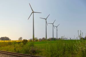 scenic landscape with wind turbines in spring