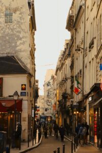 people walking on a narrow street