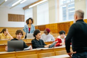 a woman standing in a classroom