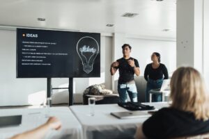 man speaking about ideas in meeting