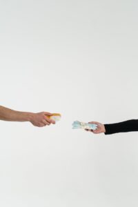 person trading money for drugs