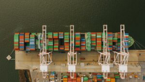 colorful cargo containers on ship near pier